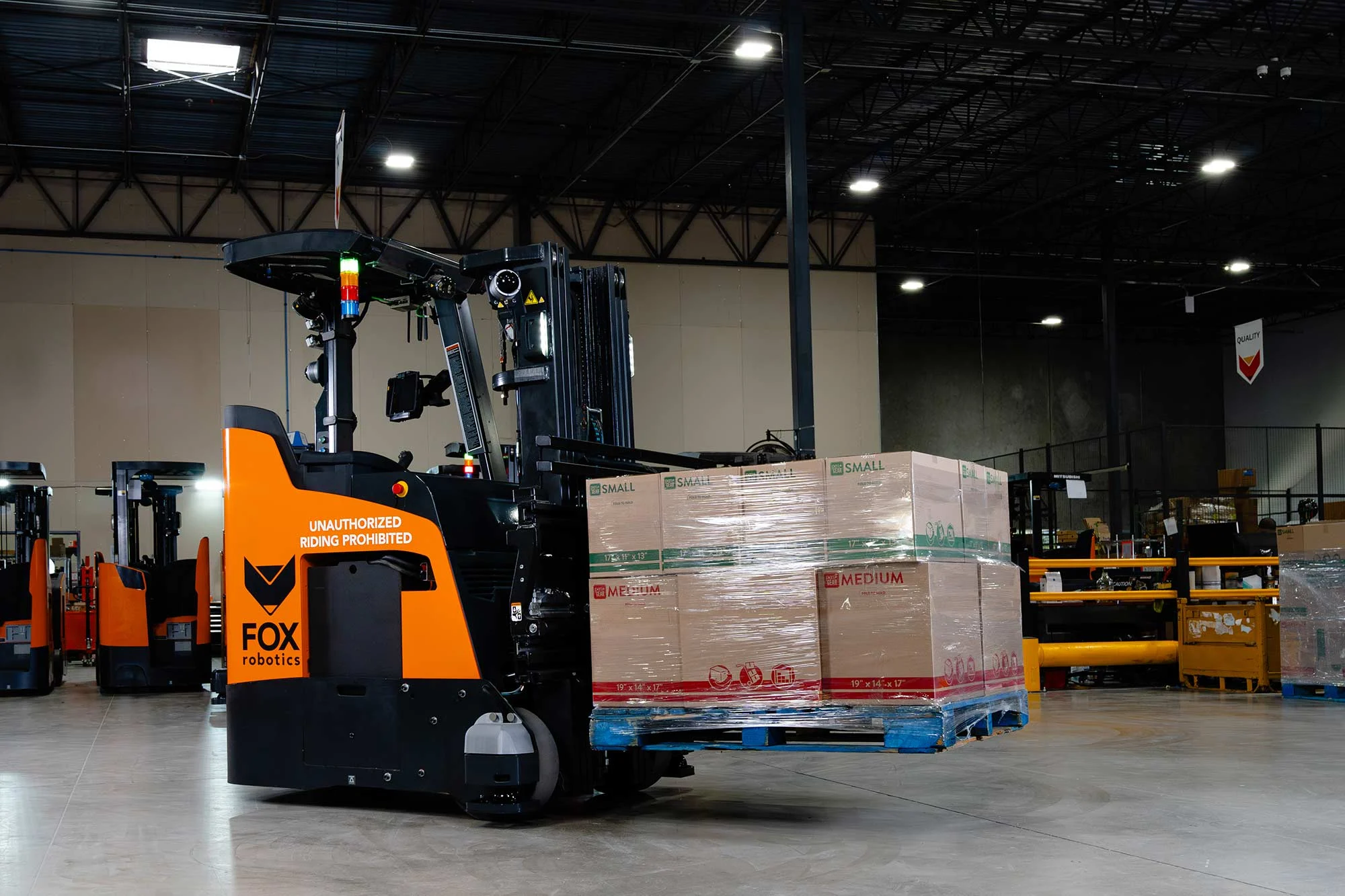 Electric forklift operating inside a warehouse